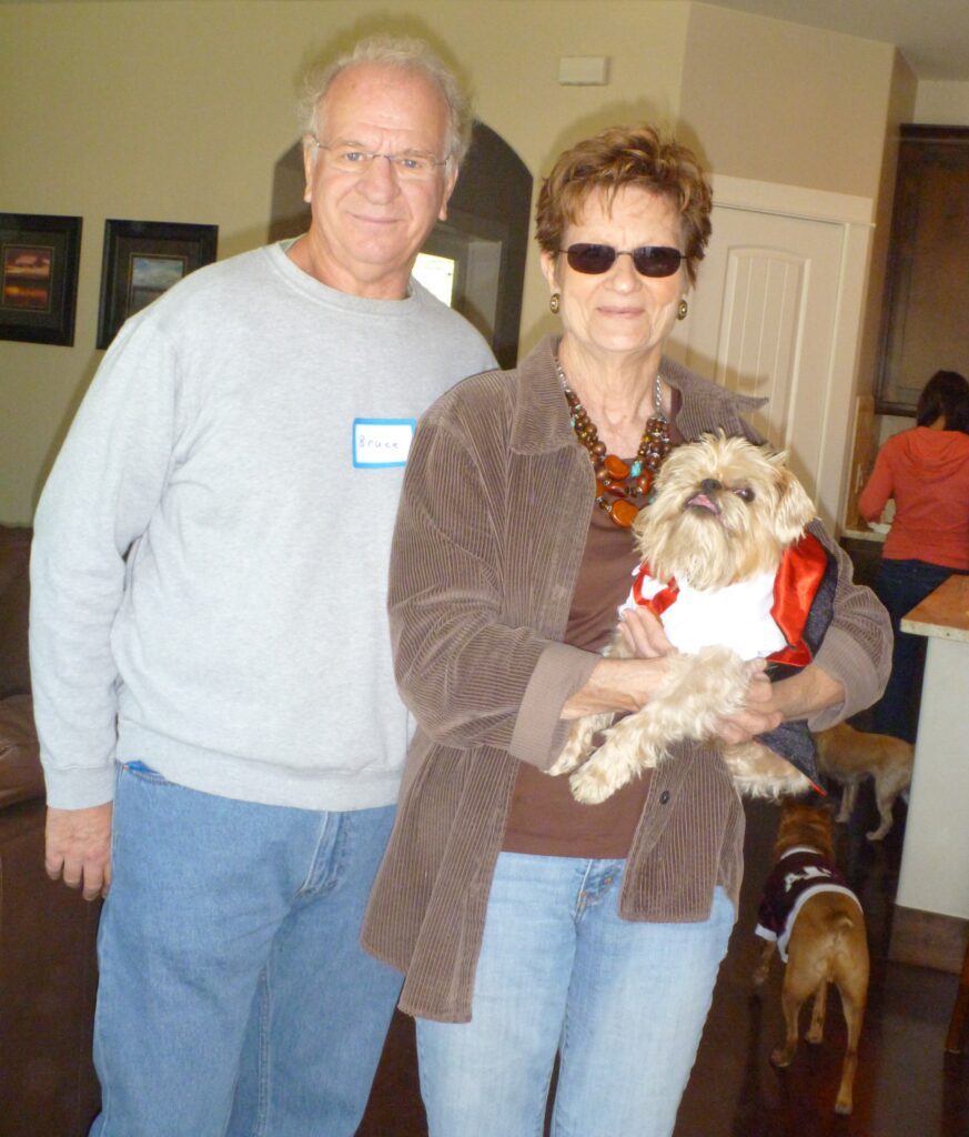 A woman and her dog wearing matching shirts.