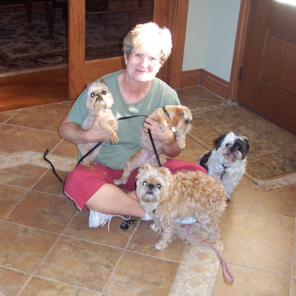 A woman and her dog wearing matching shirts.